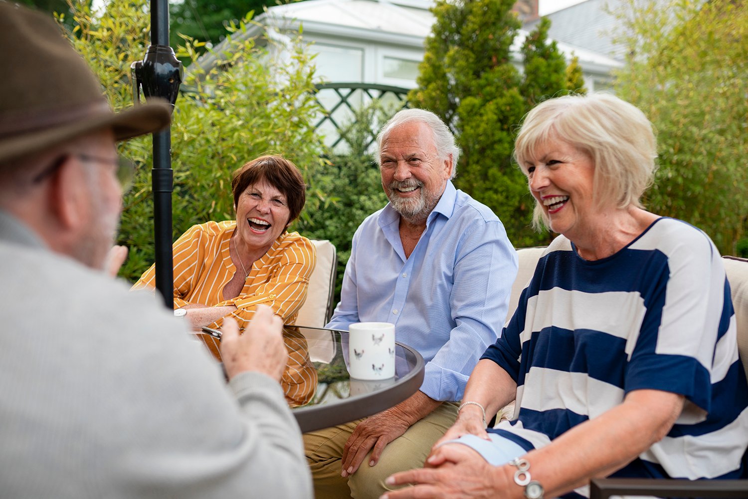 Friends talking and laughing outdoors